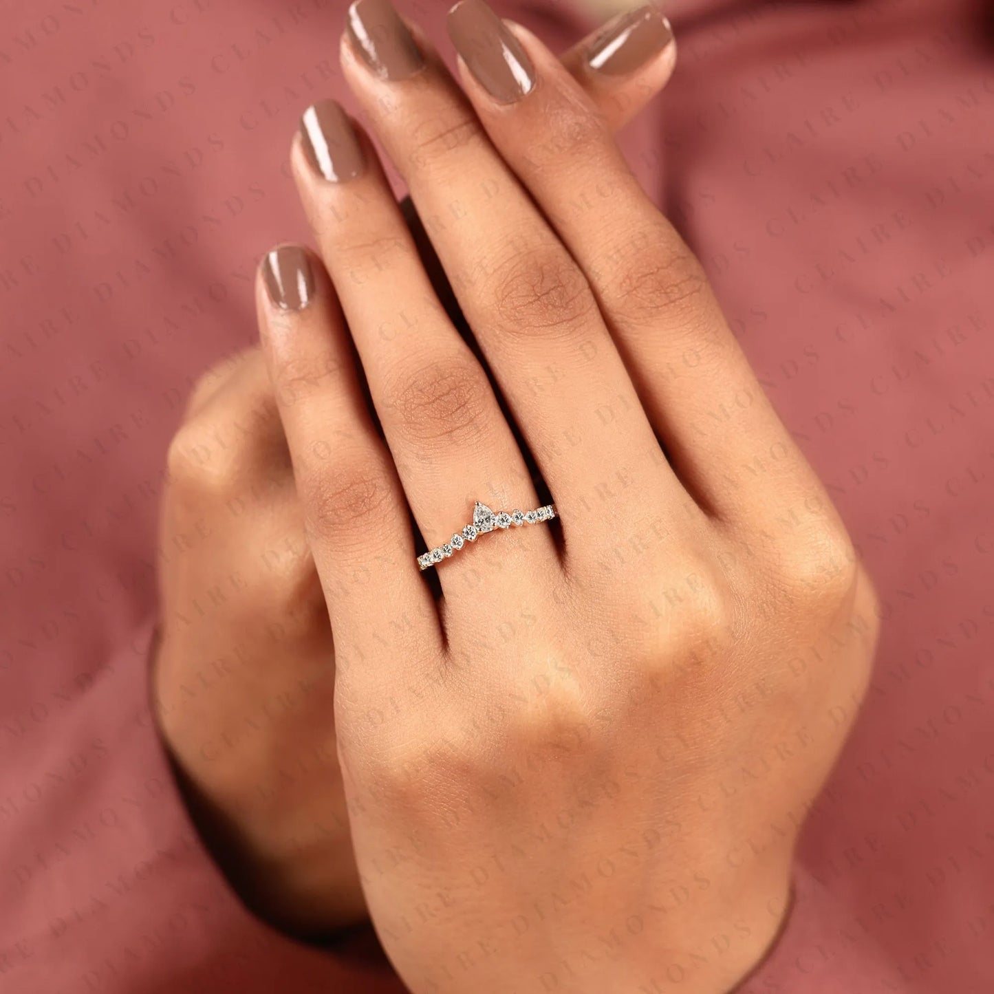 0.64 tcw classic pear cut lab grown diamond anniversary ring with delicate round brilliant diamonds and everyday sparkle