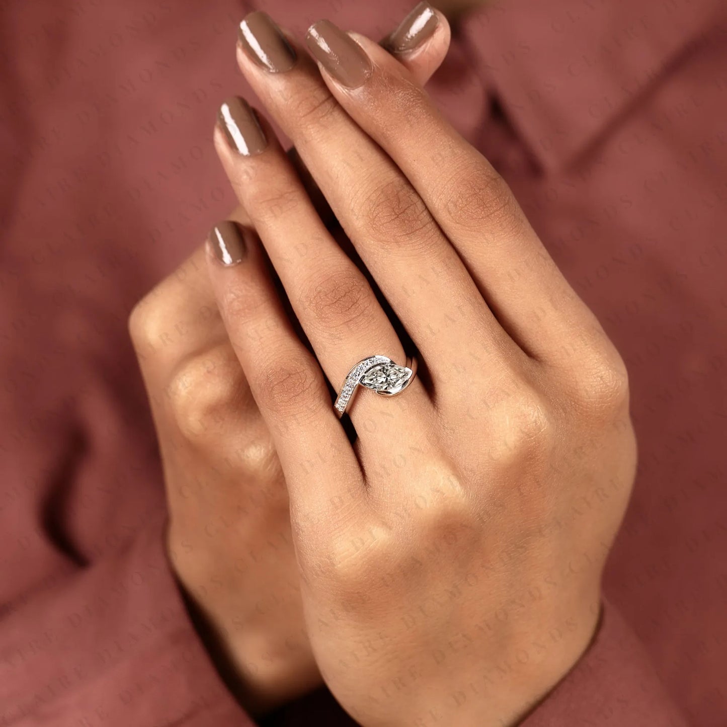marquise cut lab grown diamond east west bypass engagement ring in gold with round side stones , modern bridal jewelry.