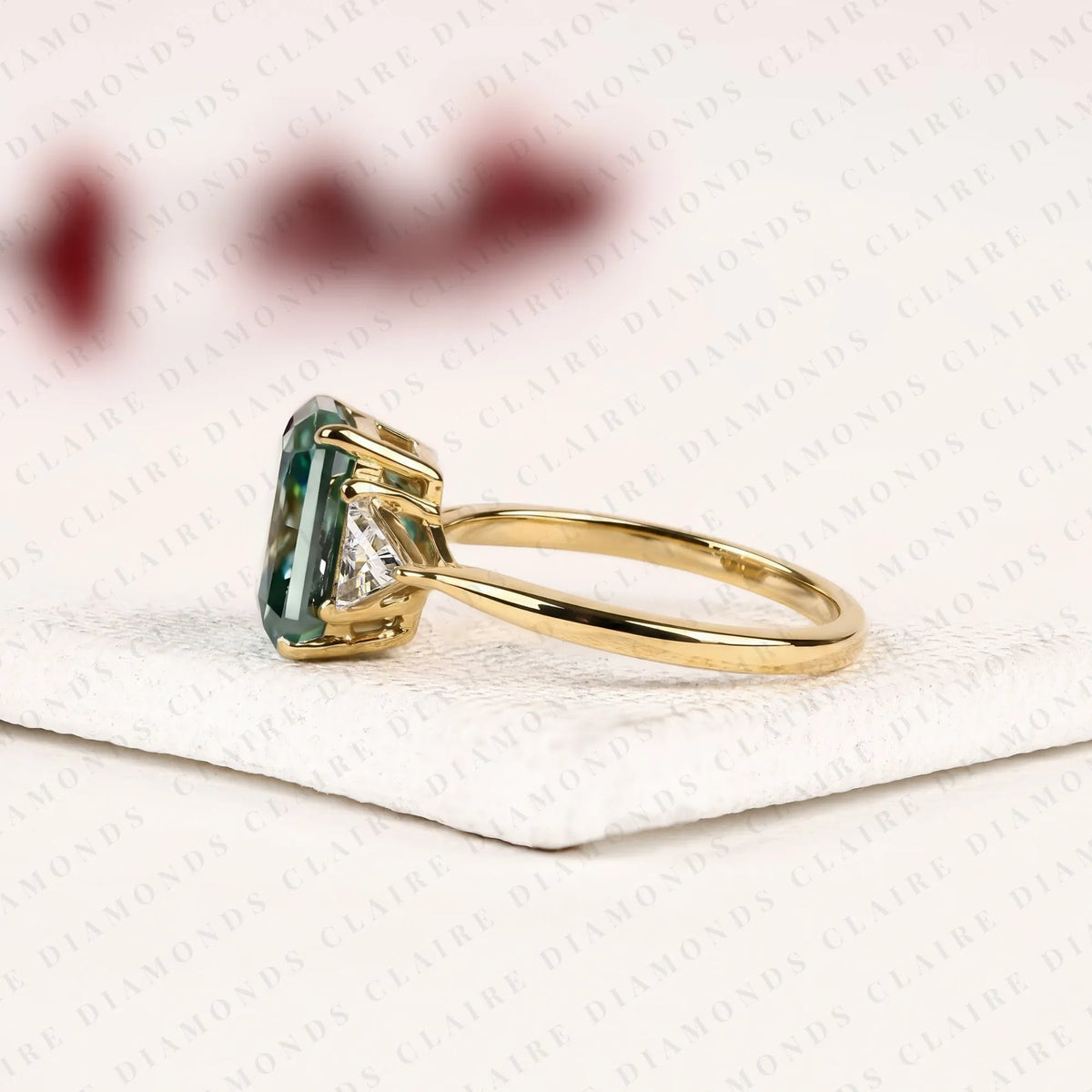 radiant cut green lab grown diamond engagement ring  three stone ring with trillion diamond accents luxury bridal jewelry
