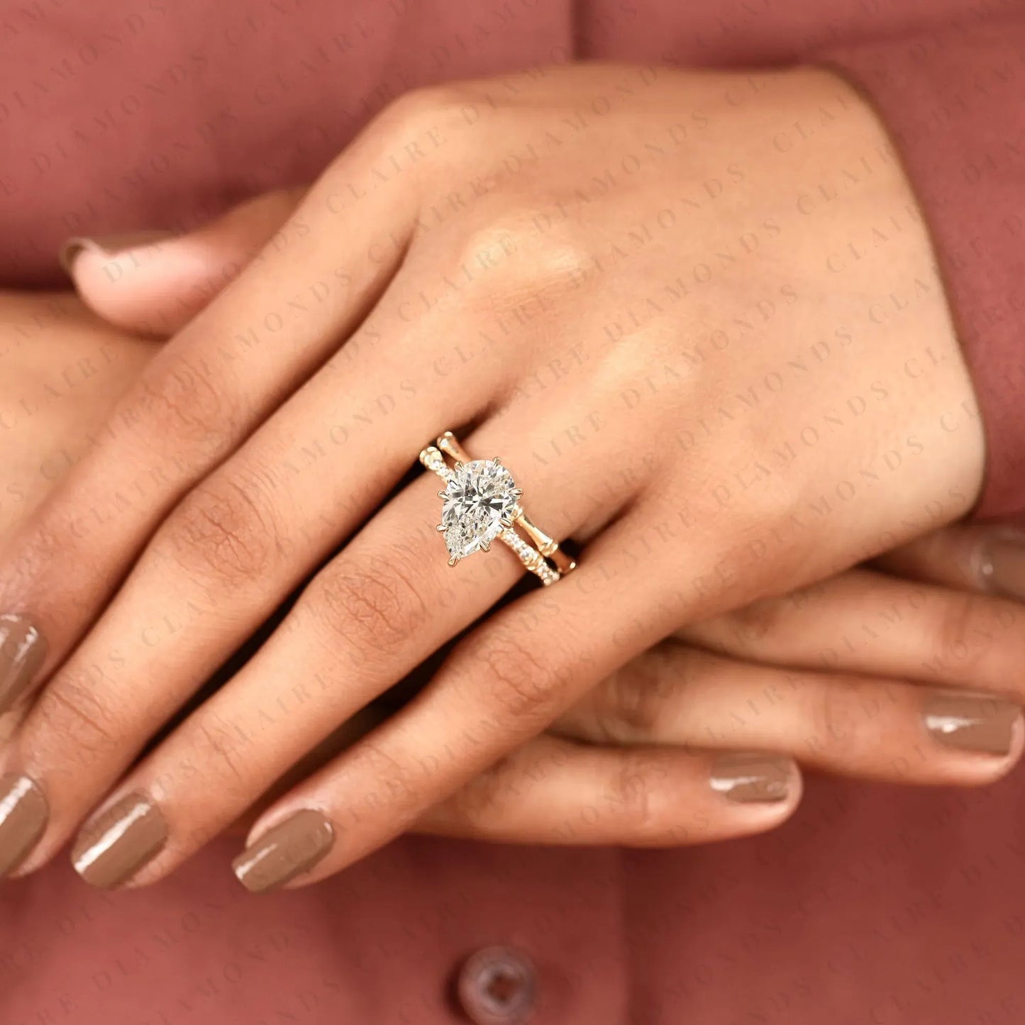 luxury pear cut moissanite diamond engagement ring with pavé diamond accents and bamboo inspired matching wedding band set