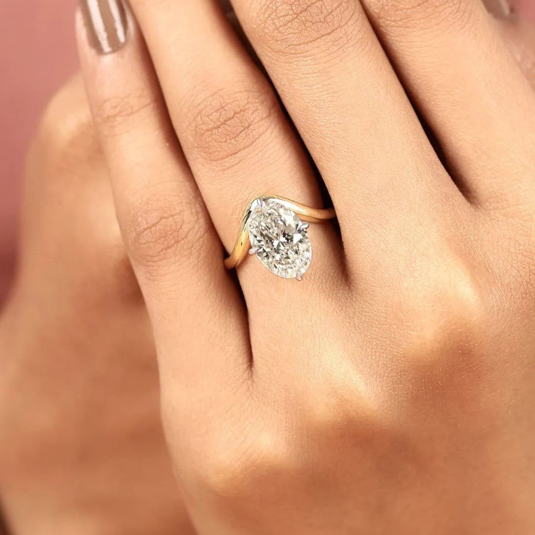 oval cut solitaire lab grown diamonds two tone engagement ring with sculpted gold band – modern elegance redefined