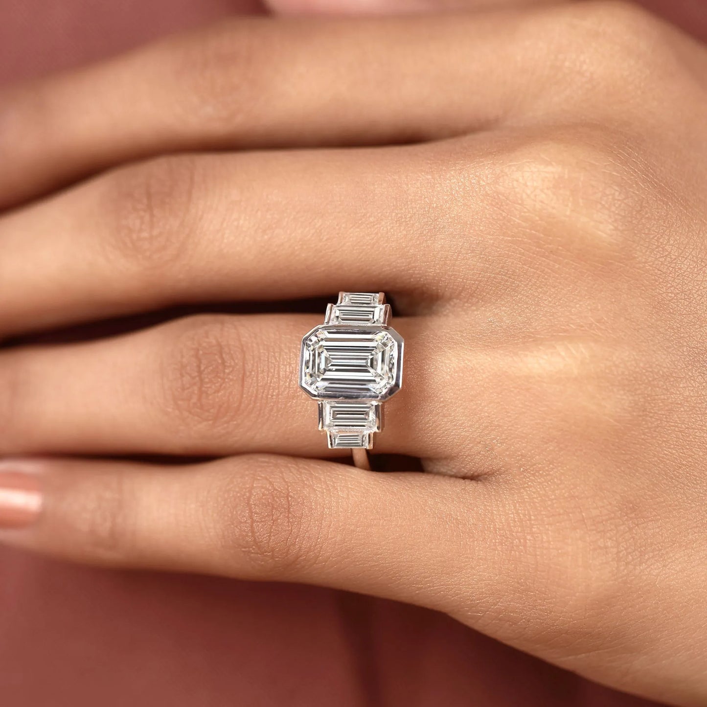 emerald cut three stone lab grown diamond engagement ring bezel set emerald diamond ring with tapered baguette side stones luxury bridal ring