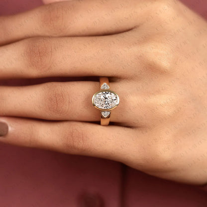 Oval Cut Moissanite Diamond Engagement Ring | Bezel Set Gold Ring with Trillion Side Stones | Modern Luxury Bridal Ring