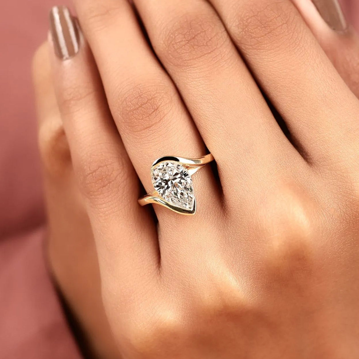pear shape lab grown diamond hidden halo solitaire ring with contemporary twist setting