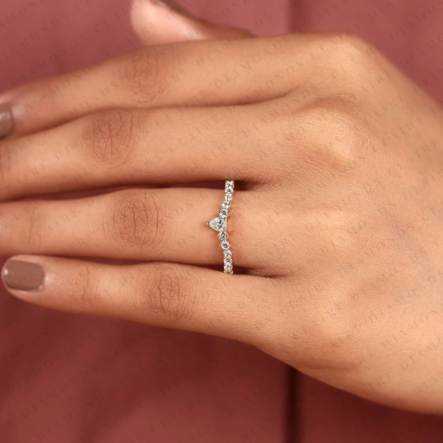 0.64 tcw classic pear cut lab grown diamond anniversary ring with delicate round brilliant diamonds and everyday sparkle