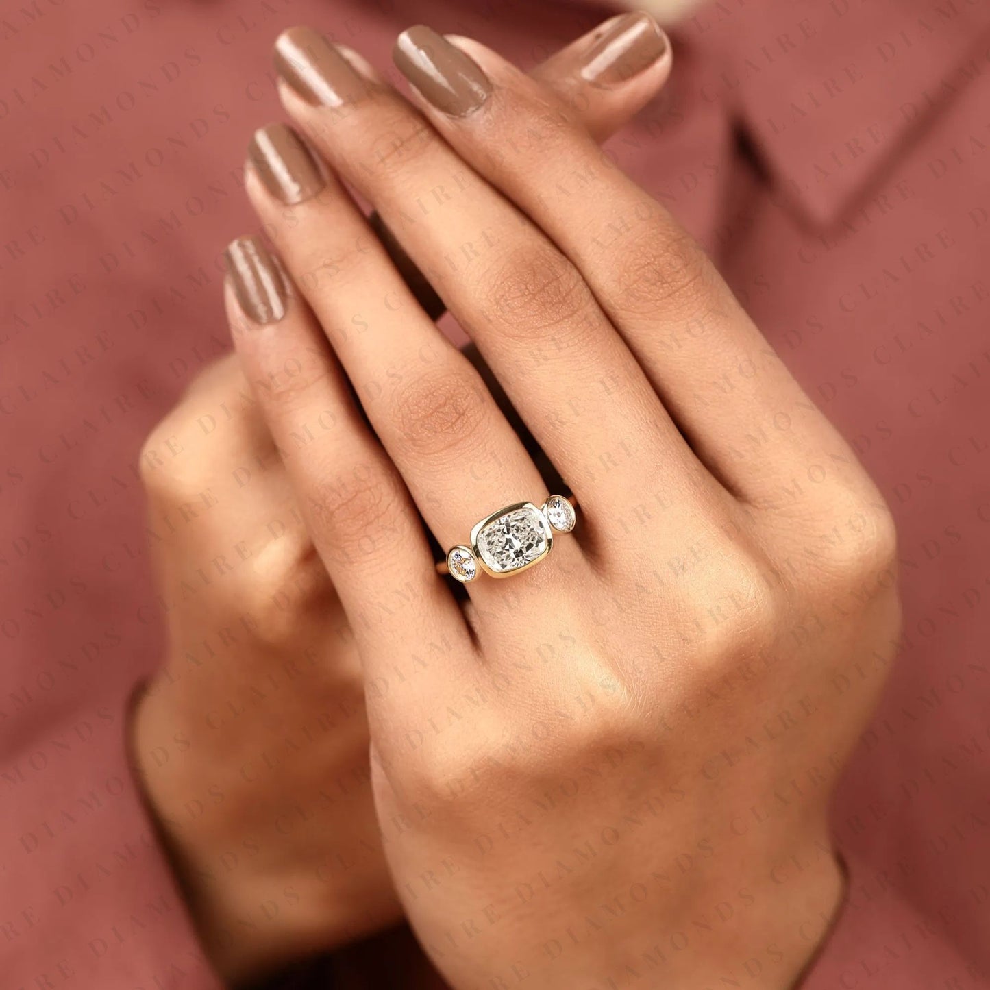 elongated cushion cut bezel set three stone lab grown diamond engagement ring modern gold ring minimalist bridal jewelry.