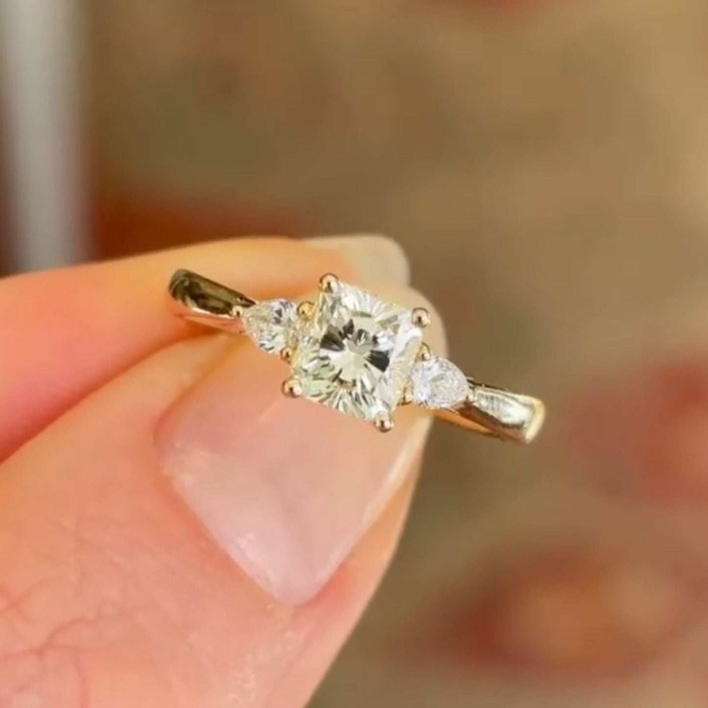 elegant cushion cut moissanite diamond three-stone ring in gold minimalist engagement ring