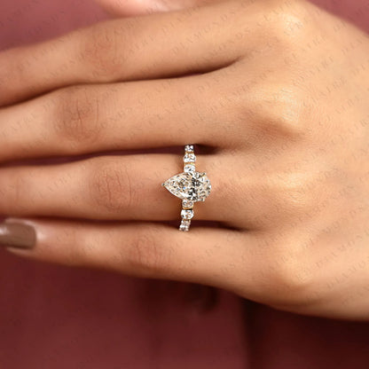 Pear Cut Moissanite Diamond Engagement Ring in Two Tone Gold Shoulder Ring with Round Diamond Accents