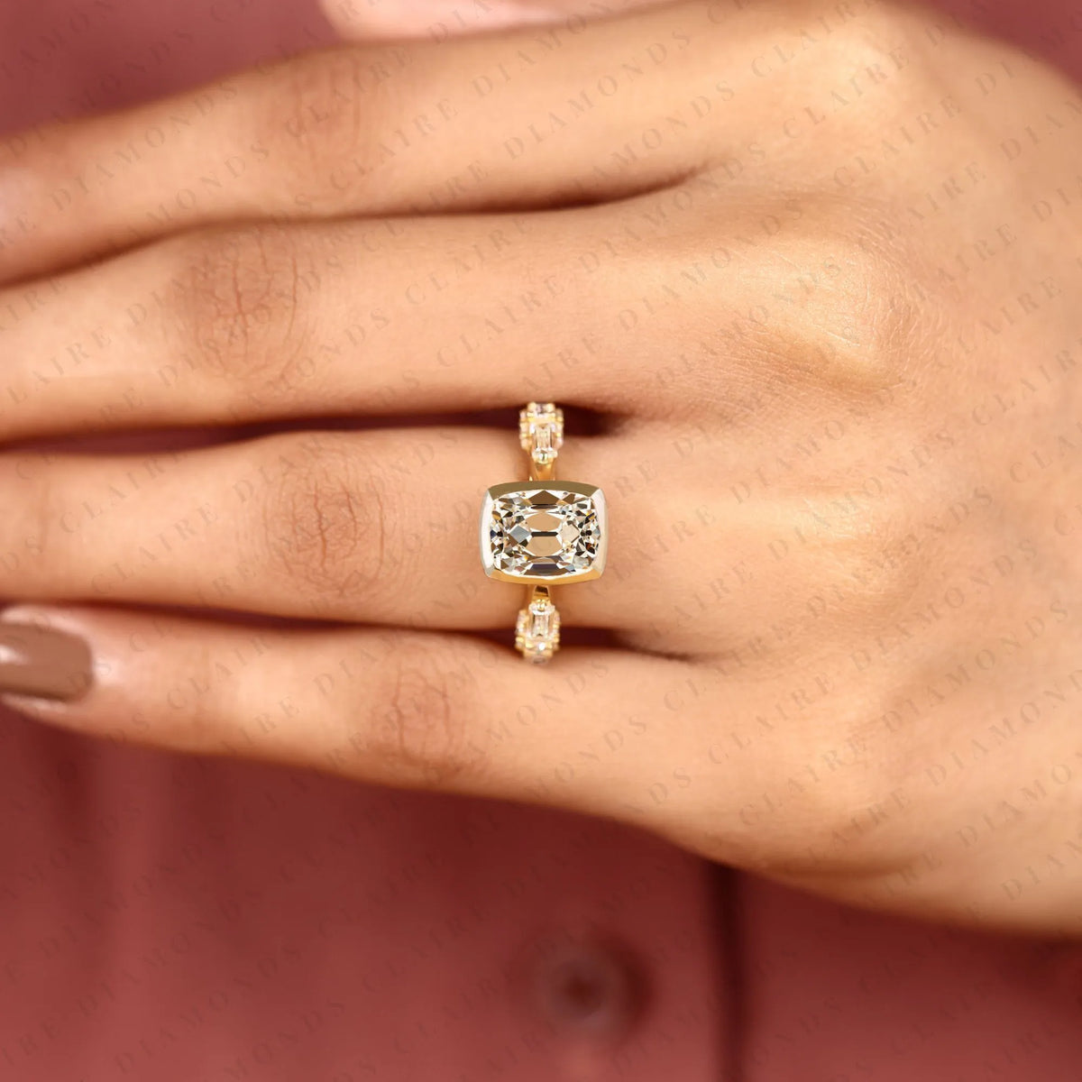 old mine elongated cushion cut lab grown diamond engagement ring yellow gold bezel ring with baguette side stone modern luxury bridal jewelry