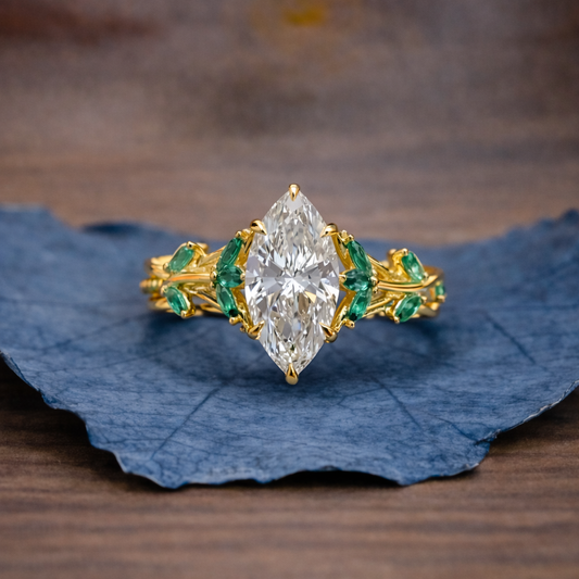 Marquise Cut Moissanite Diamond Floral Engagement Ring with Emerald Accents in Solid Gold Nature Inspired Vintage Design