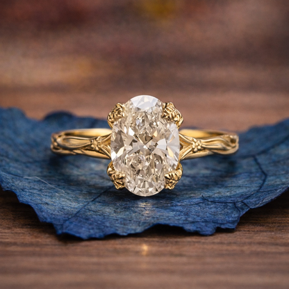 Gold ring with a large diamond on a blue leaf