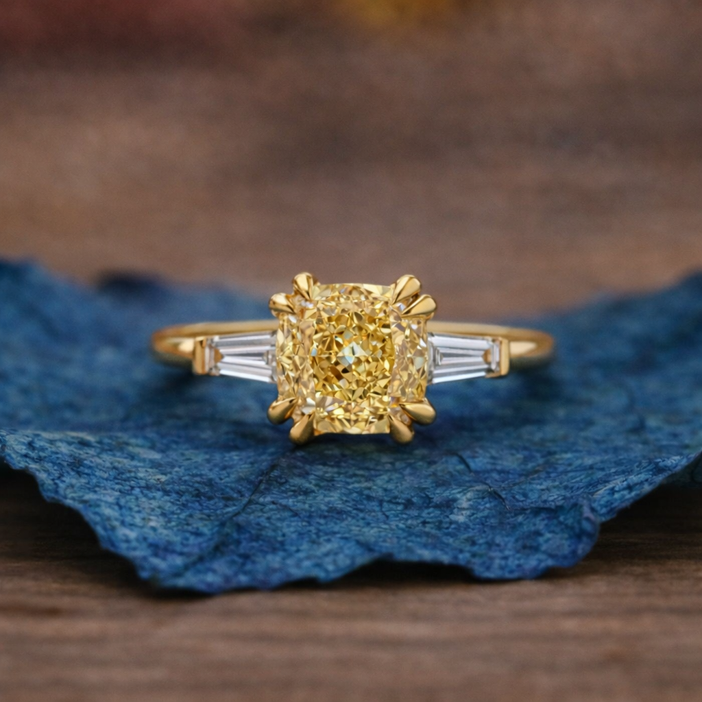 Gold ring with a diamond on a blue fabric 
