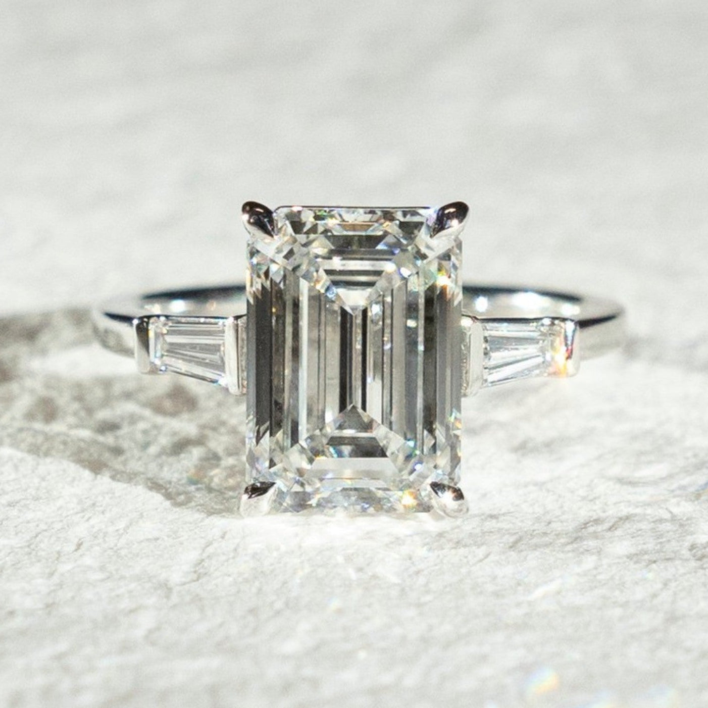 emerald three stone moissanite engagement ring past present future wedding ring