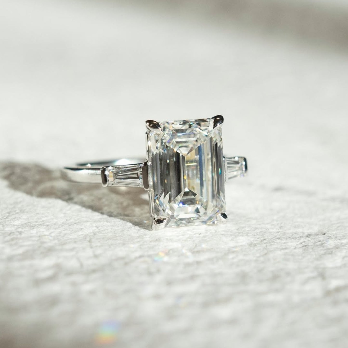 emerald three stone moissanite engagement ring past present future wedding ring