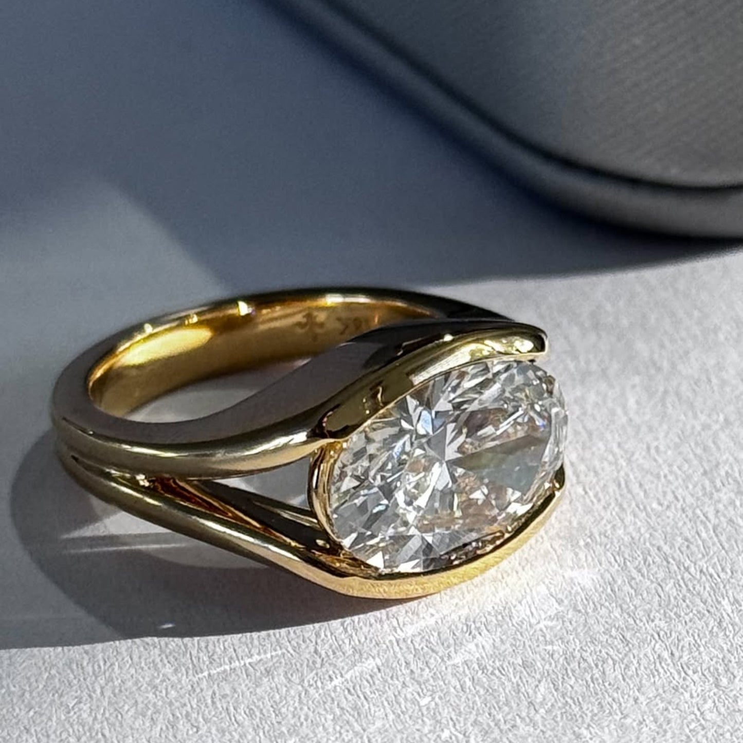 half bezel oval moissanite engagement ring east west gold split shank wedding ring