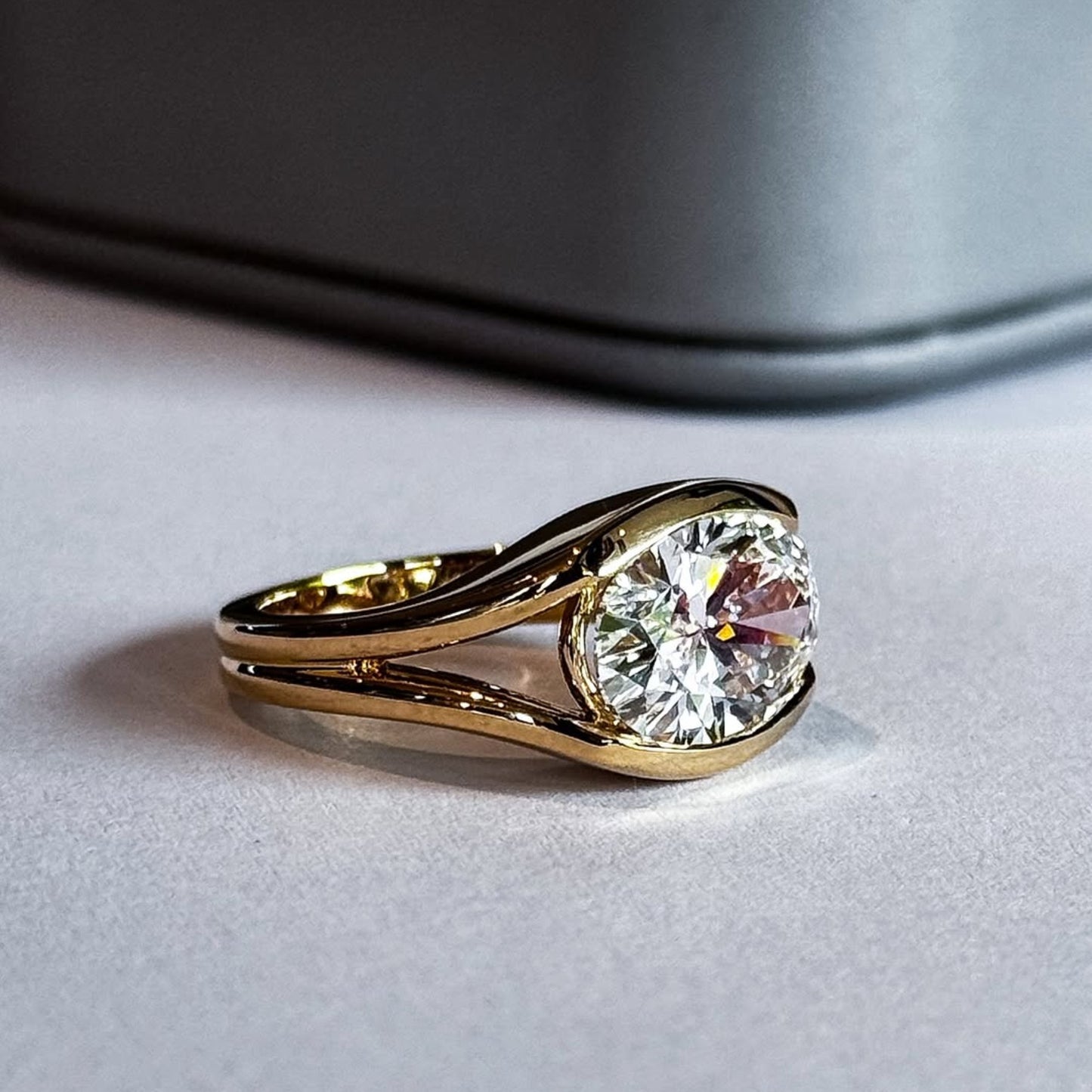 half bezel oval moissanite engagement ring east west gold split shank wedding ring