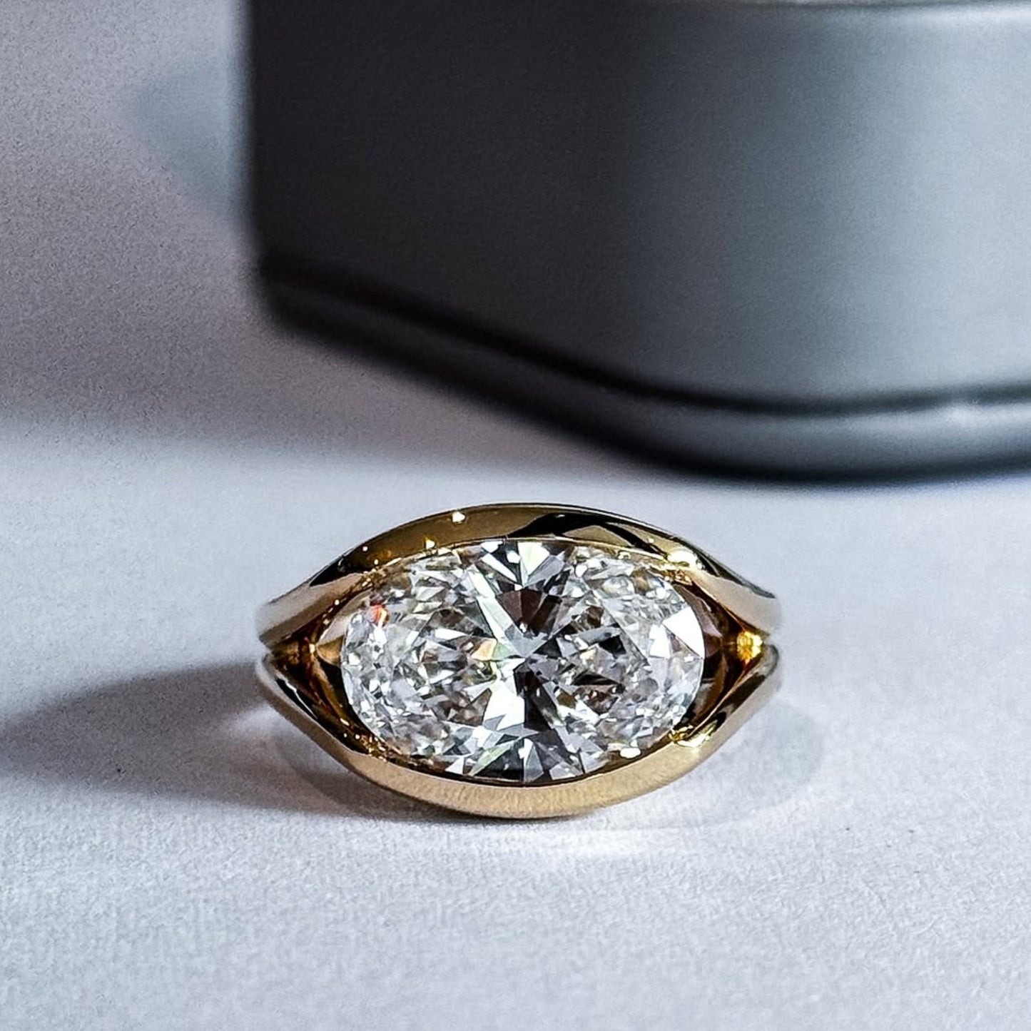 half bezel oval moissanite engagement ring east west gold split shank wedding ring