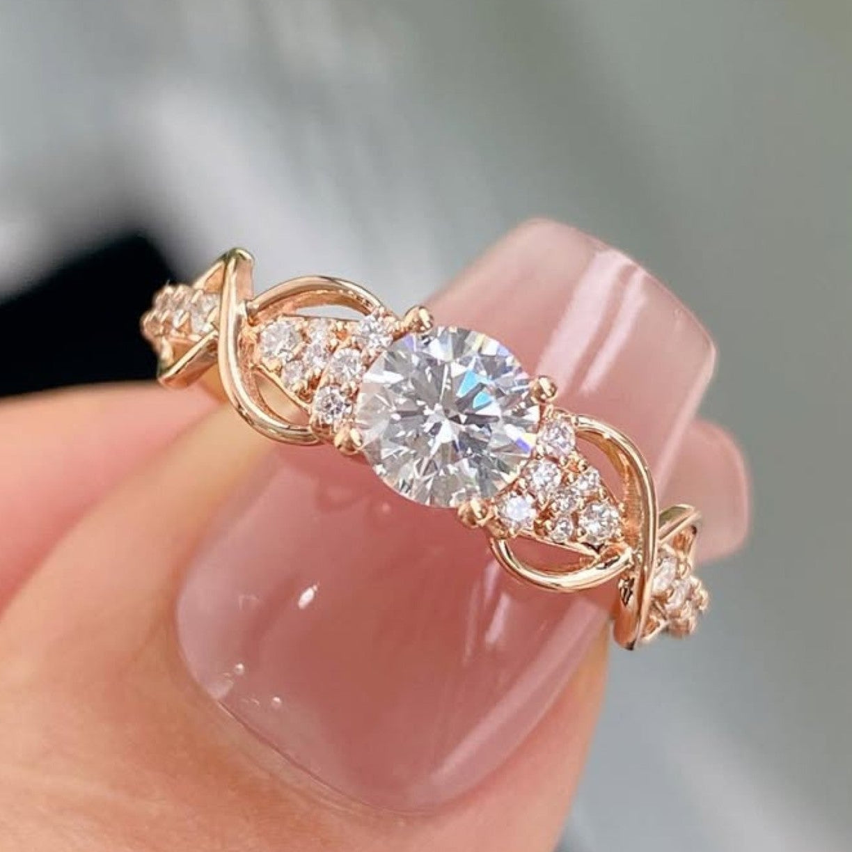 1.00 ct round cut diamond vintage inspired engagement ring with twisted gold band and side accents | elegant moissanite diamond ring