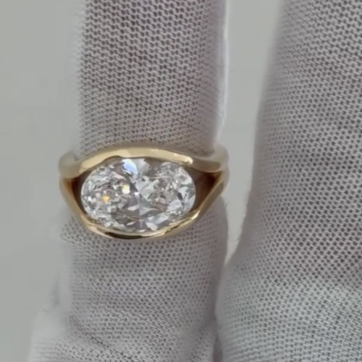 half bezel oval moissanite engagement ring east west gold split shank wedding ring