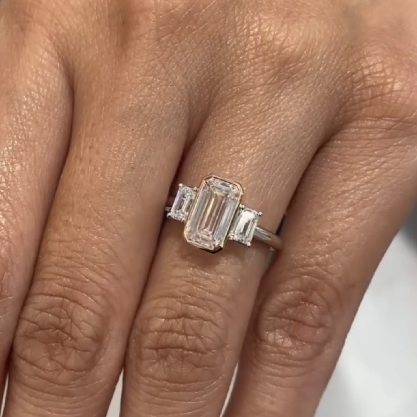 emerald cut lab grown  diamond three stone engagement ring bezel setting handmade luxury ring
