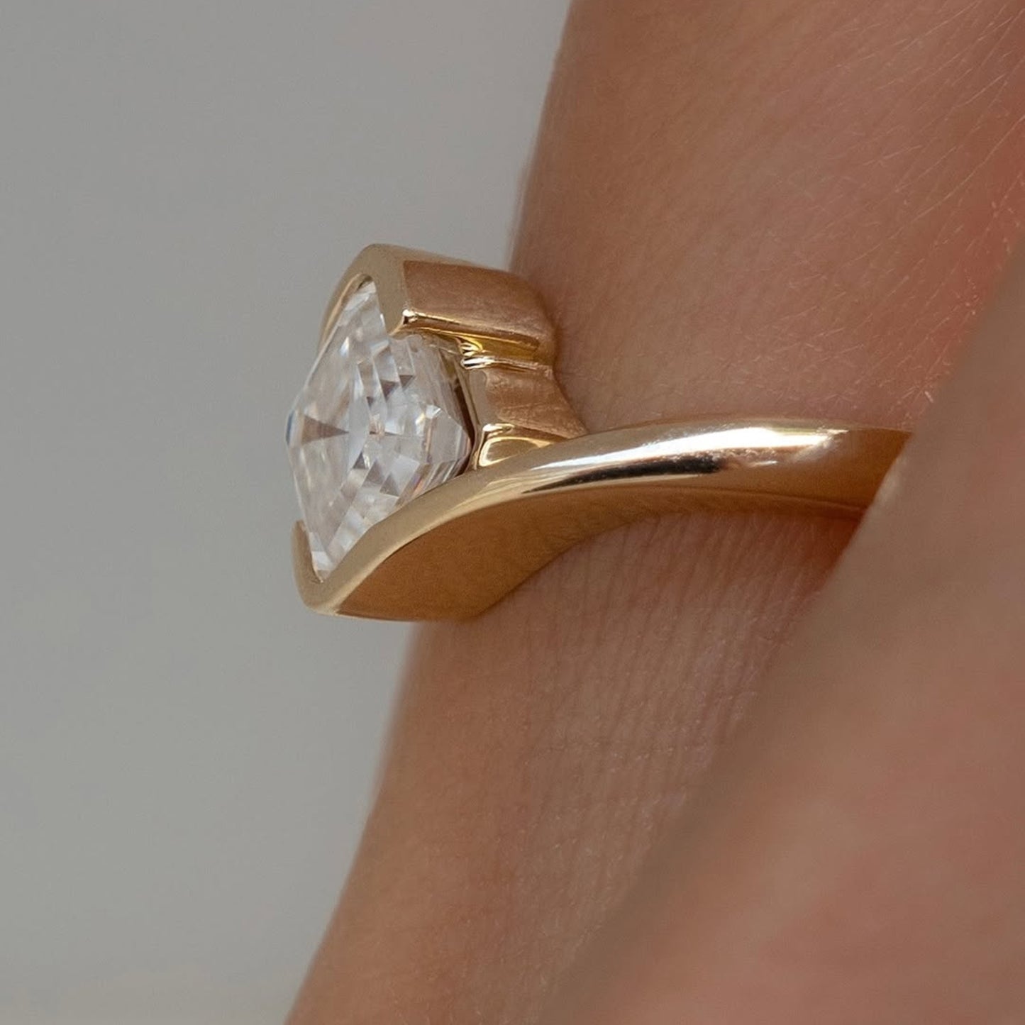 asscher cut lab grown engagement ring half bezel east west wedding ring