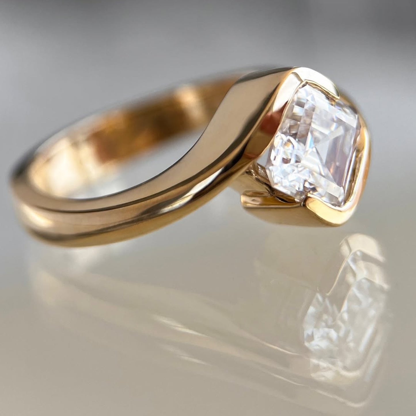 asscher cut lab grown engagement ring half bezel east west wedding ring