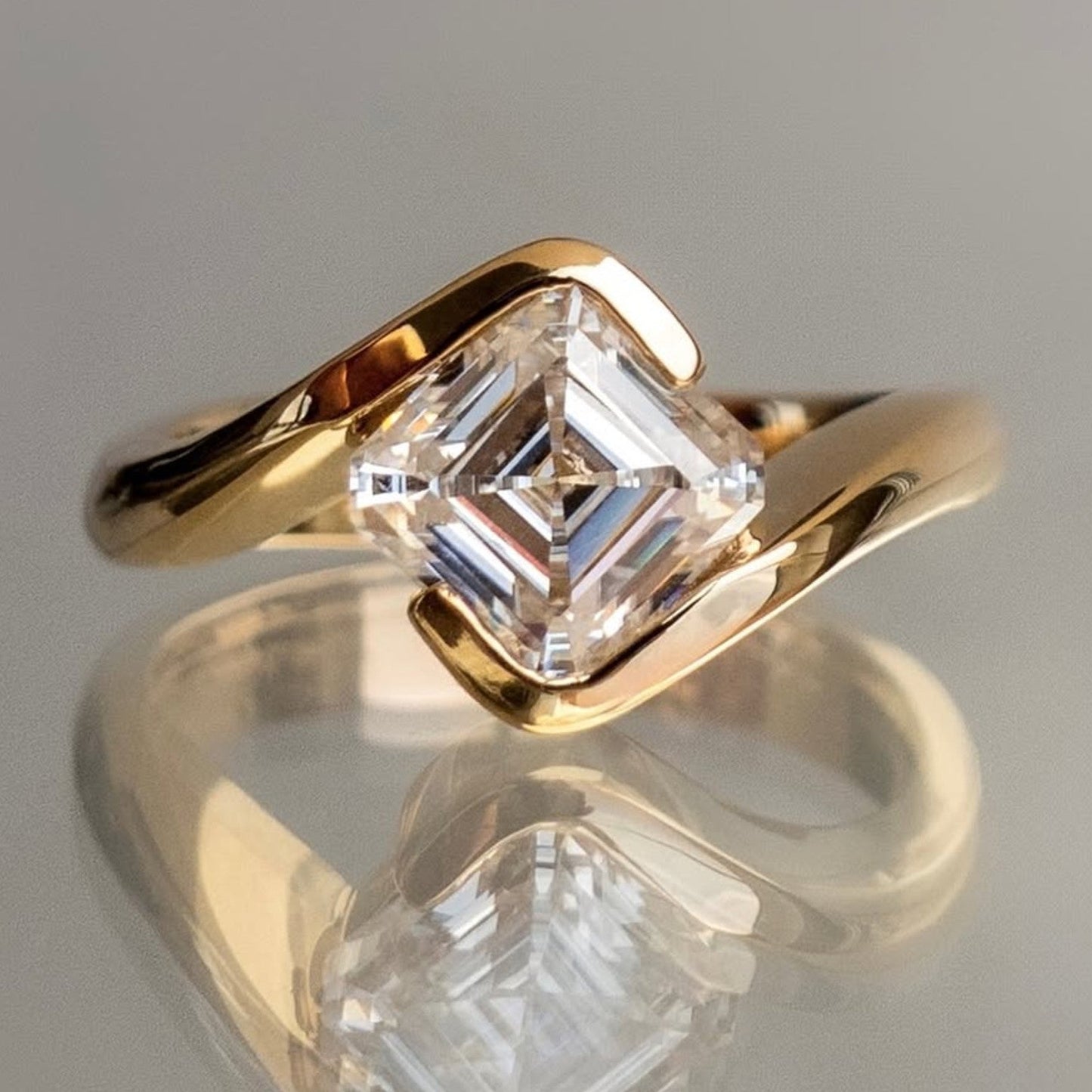 asscher cut lab grown engagement ring half bezel east west wedding ring
