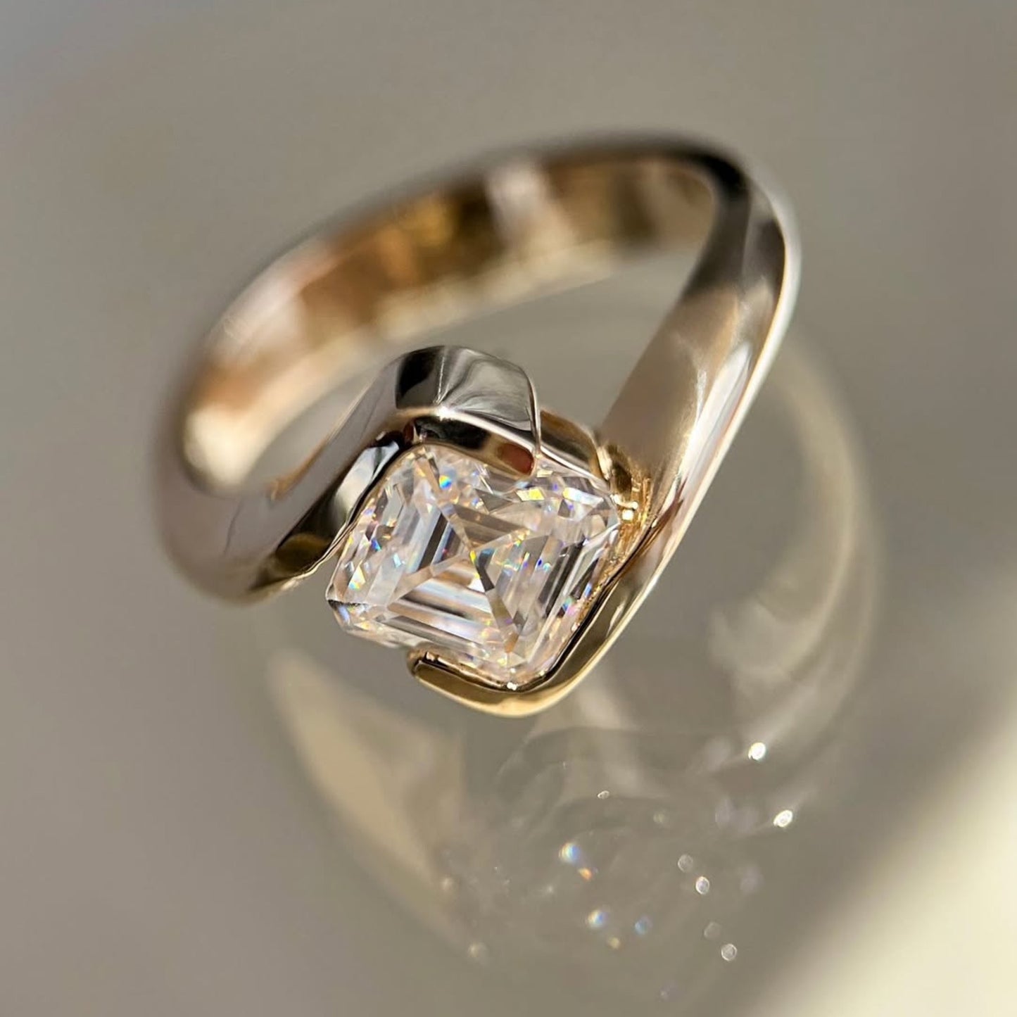asscher cut lab grown engagement ring half bezel east west wedding ring