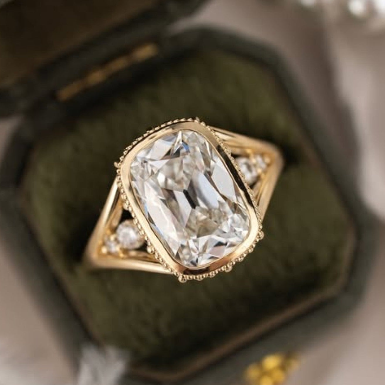 old mine elongated cushion moissanite engagement ring bezel set vintage inspired ring