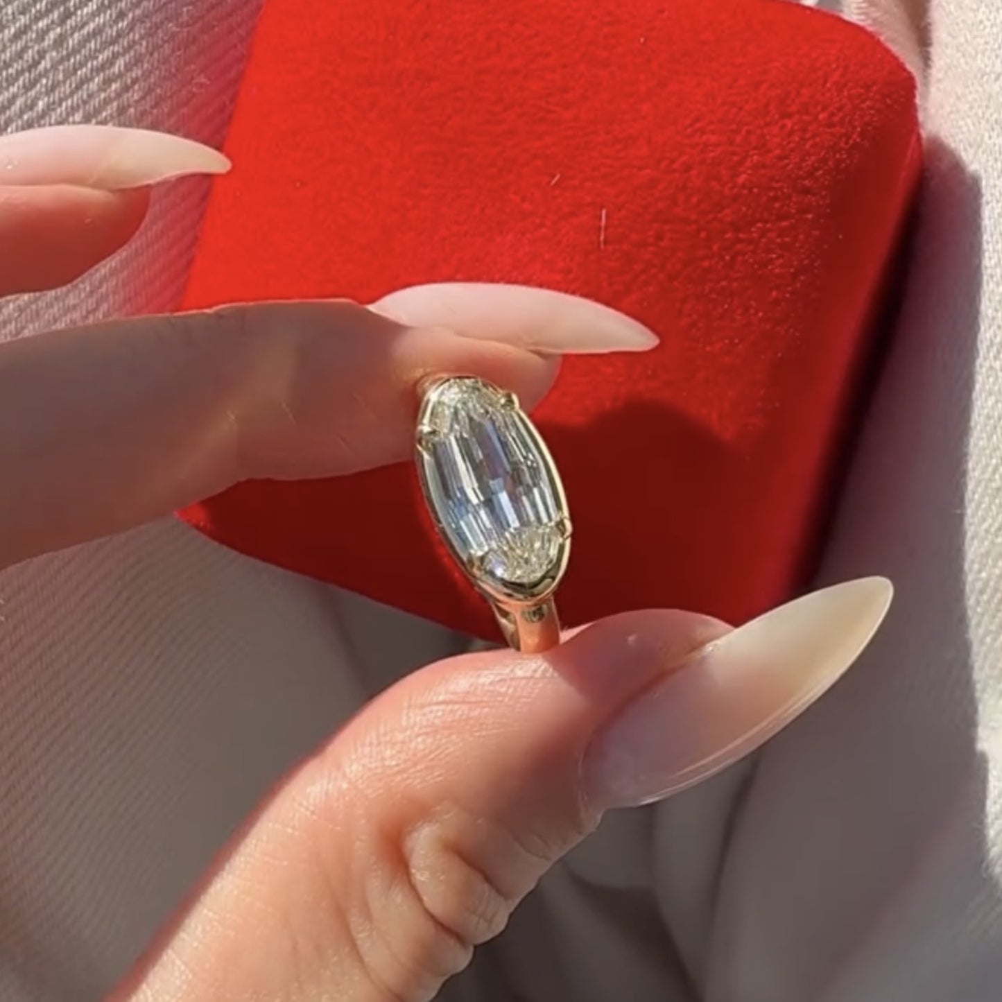 moval cut lab grown engagement ring east west gold bezel set ring
