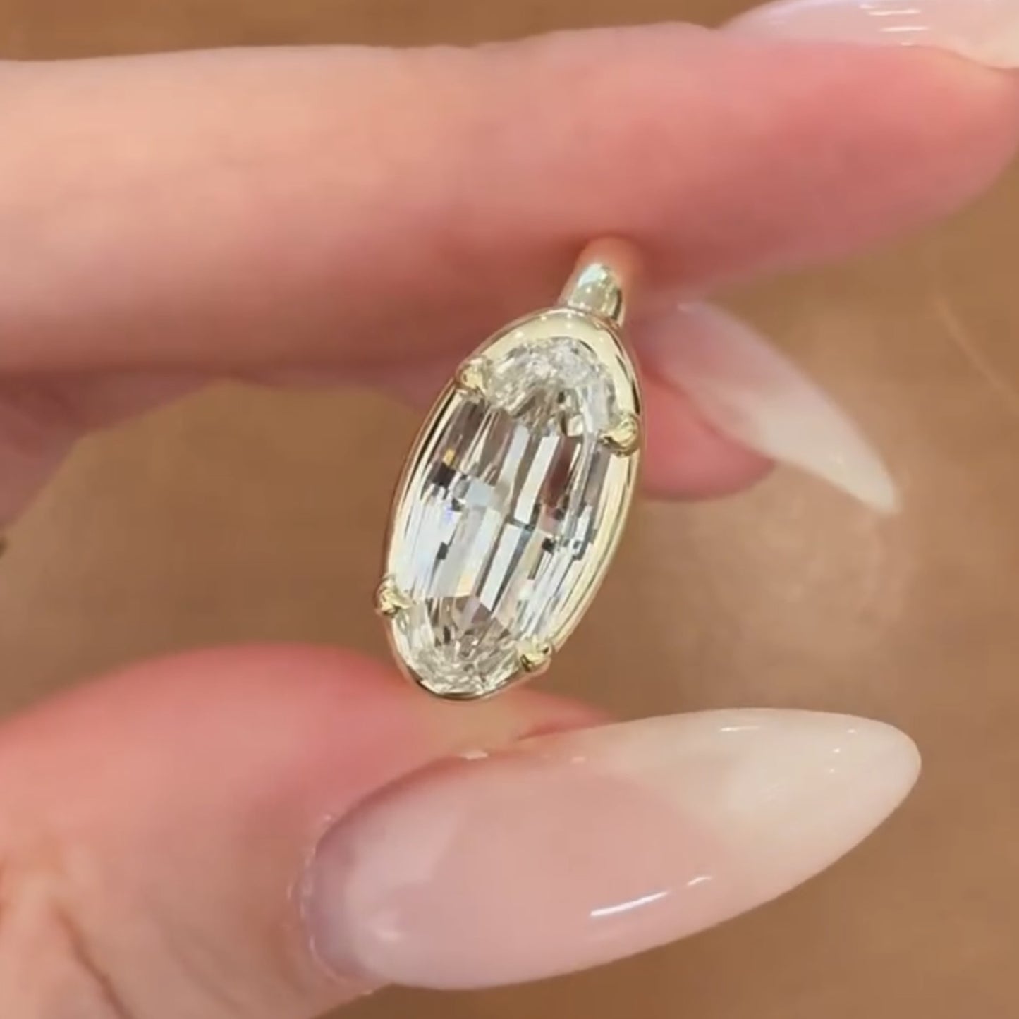 moval cut lab grown engagement ring east west gold bezel set ring
