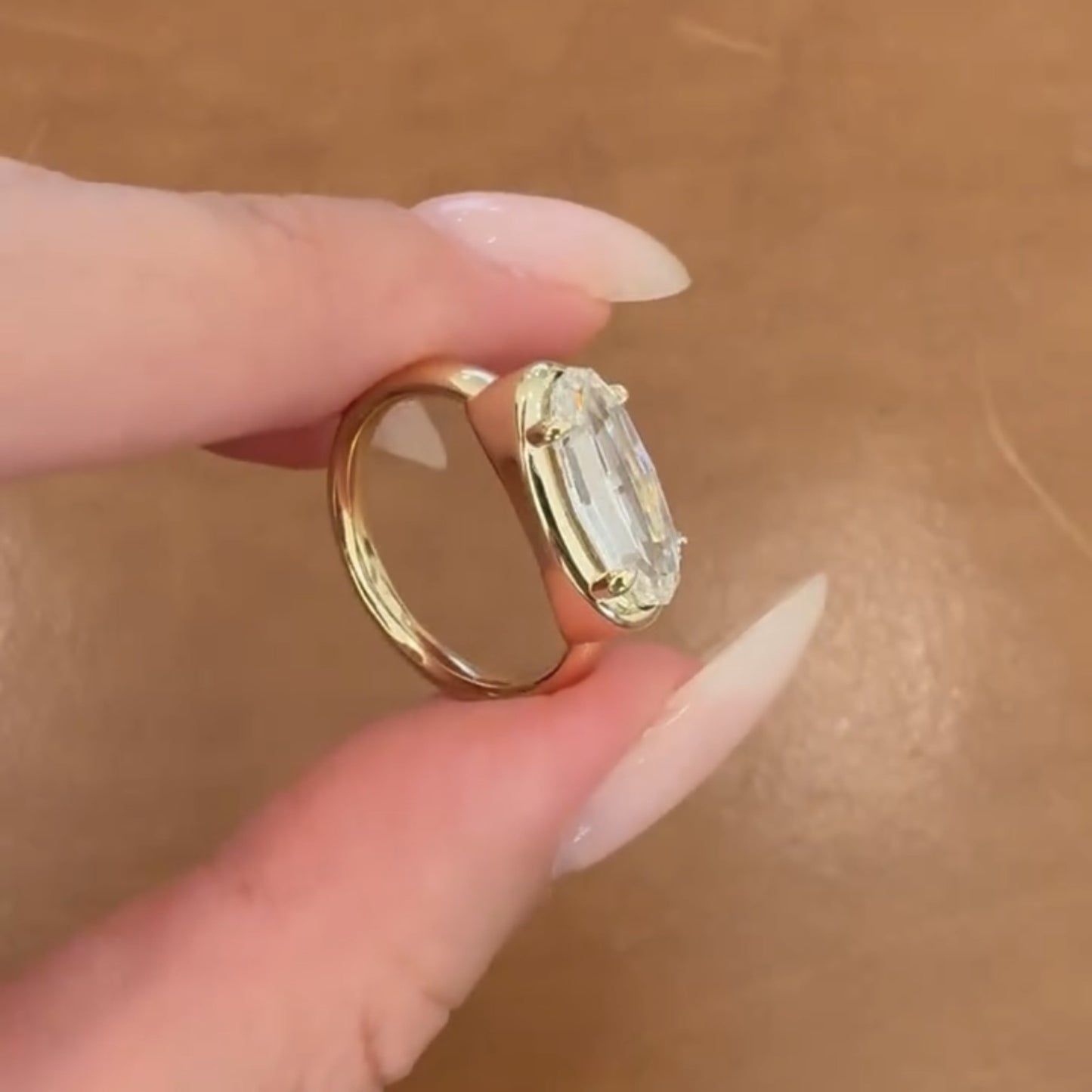 moval cut lab grown engagement ring east west gold bezel set ring