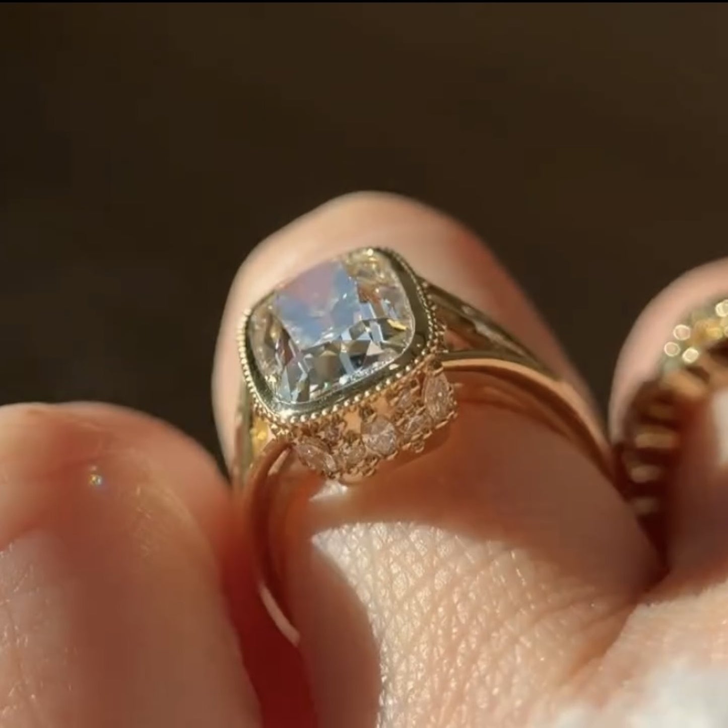 old mine elongated cushion moissanite engagement ring bezel set vintage inspired ring