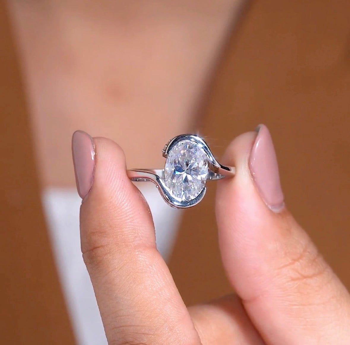elegant oval cut moissanite diamond bypass solitaire engagement ring modern bridal design
