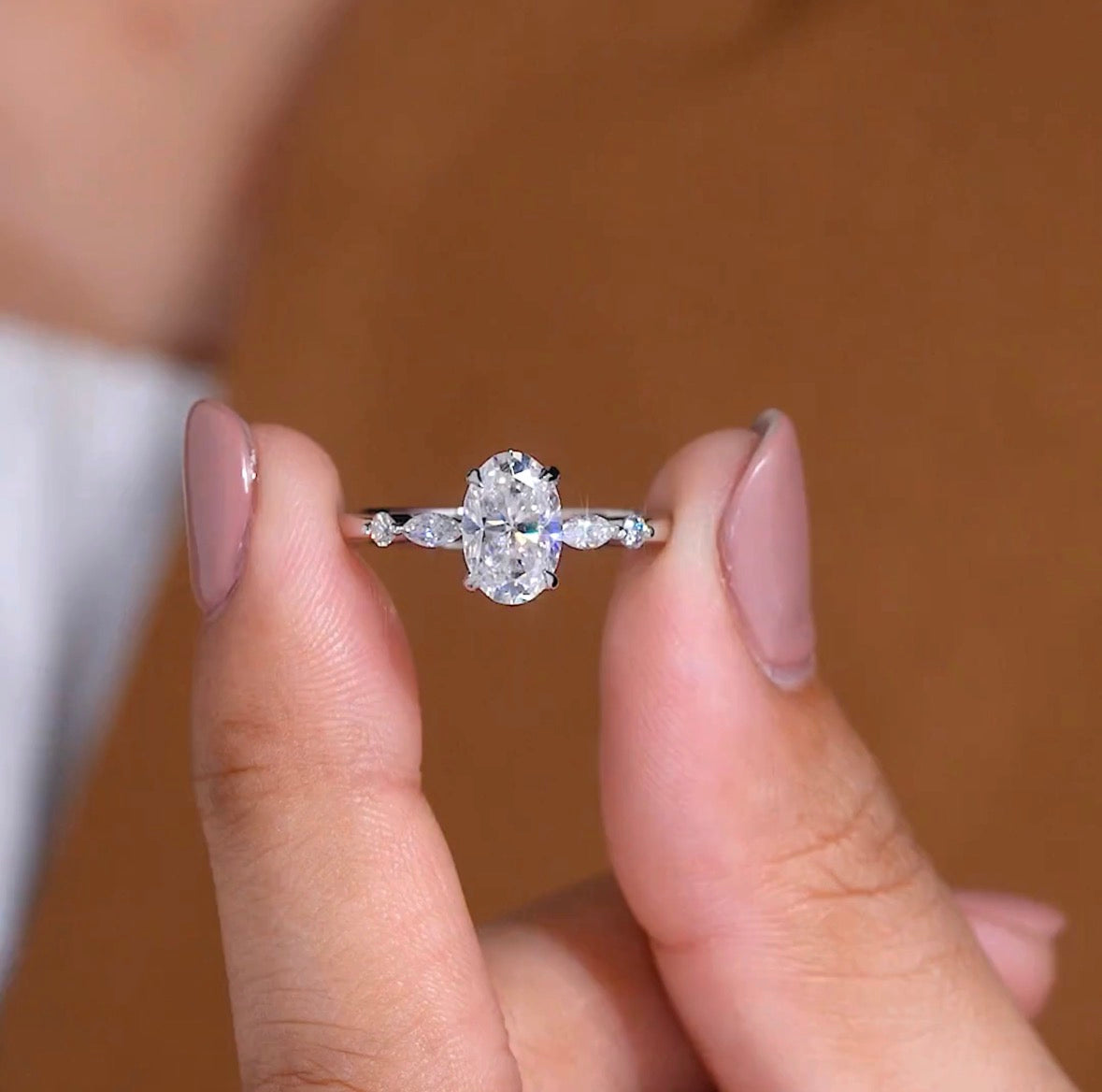 elegant oval cut lab grown diamond engagement ring with marquise side stones in white gold