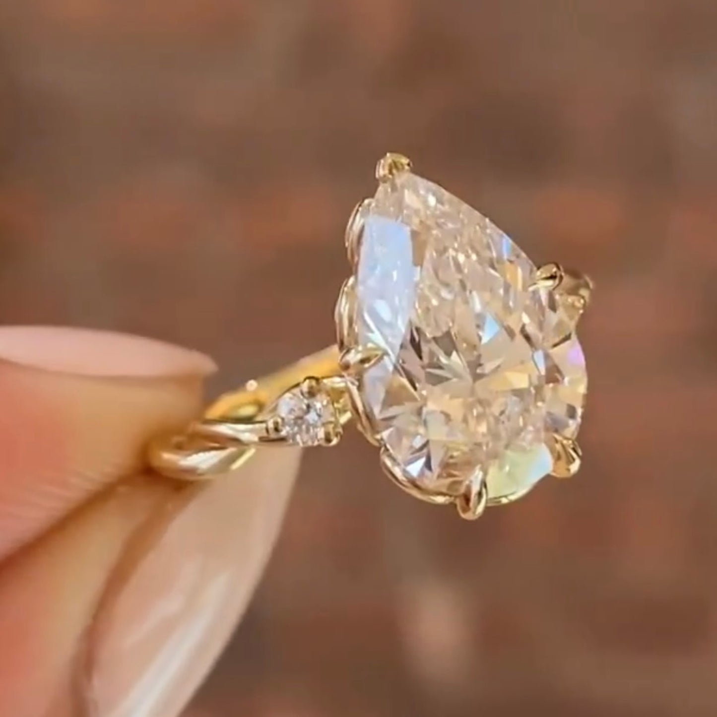 pear cut moissanite diamond ring three stone tulip set twisted band ring