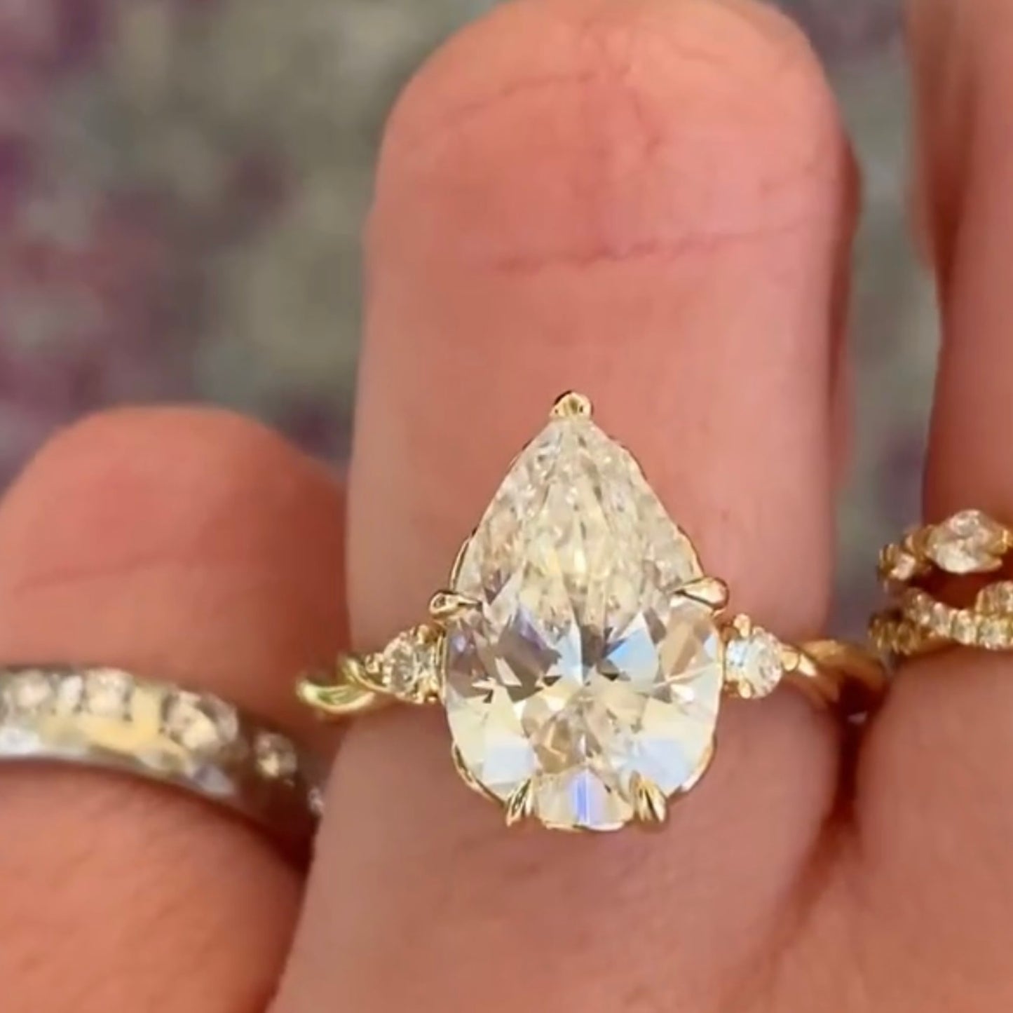 pear cut moissanite diamond ring three stone tulip set twisted band ring