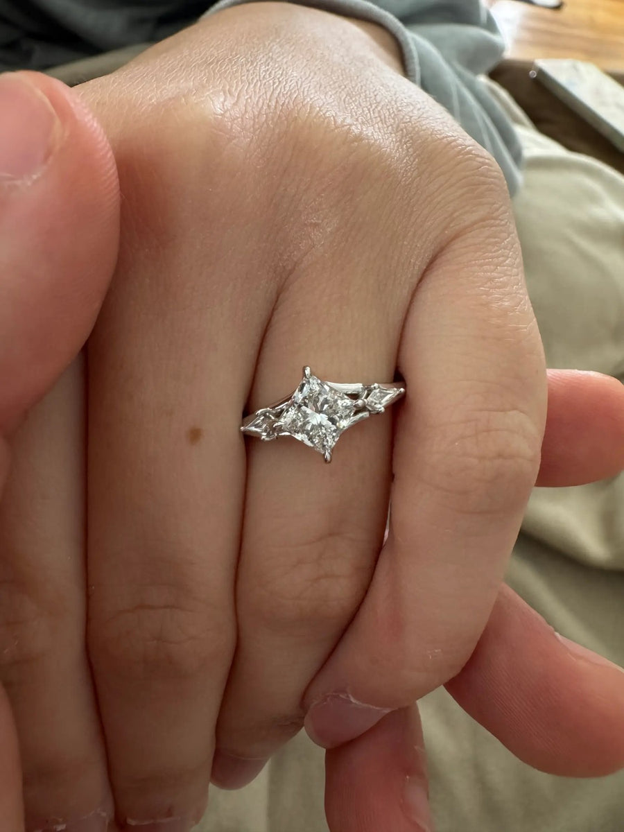 Kite-set three-stone ring in white gold