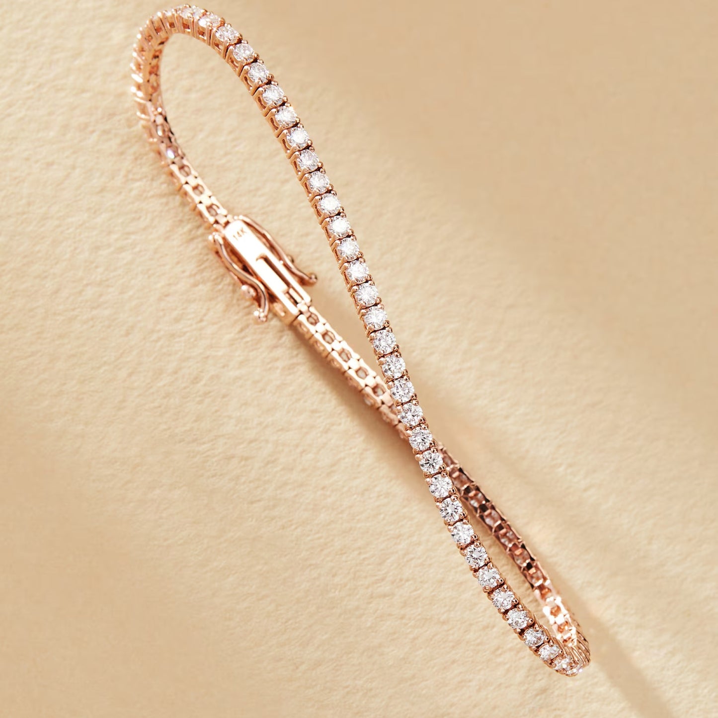 rose gold bracelet with diamonds on a beige 