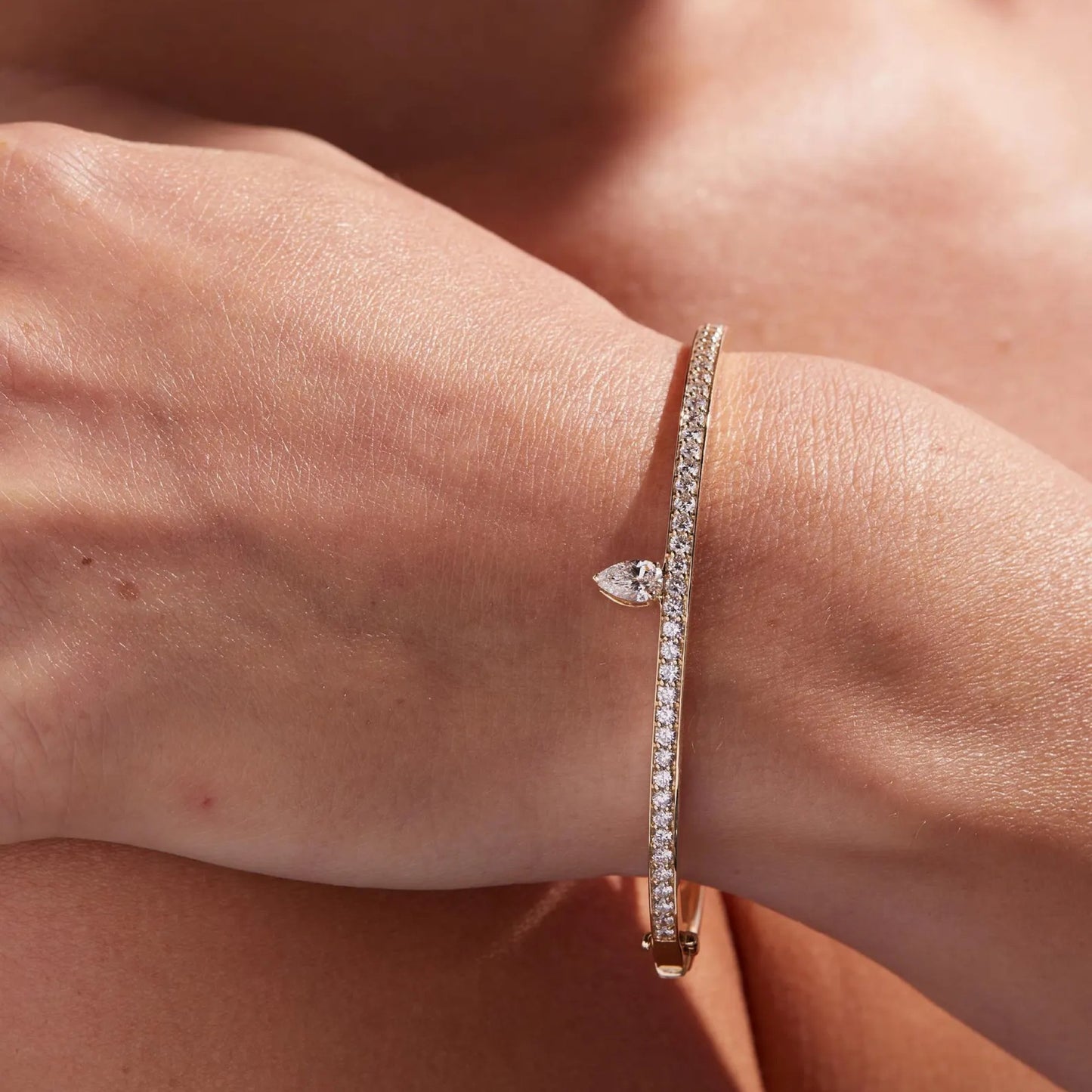 rose gold bracelet with diamonds on a wrist
