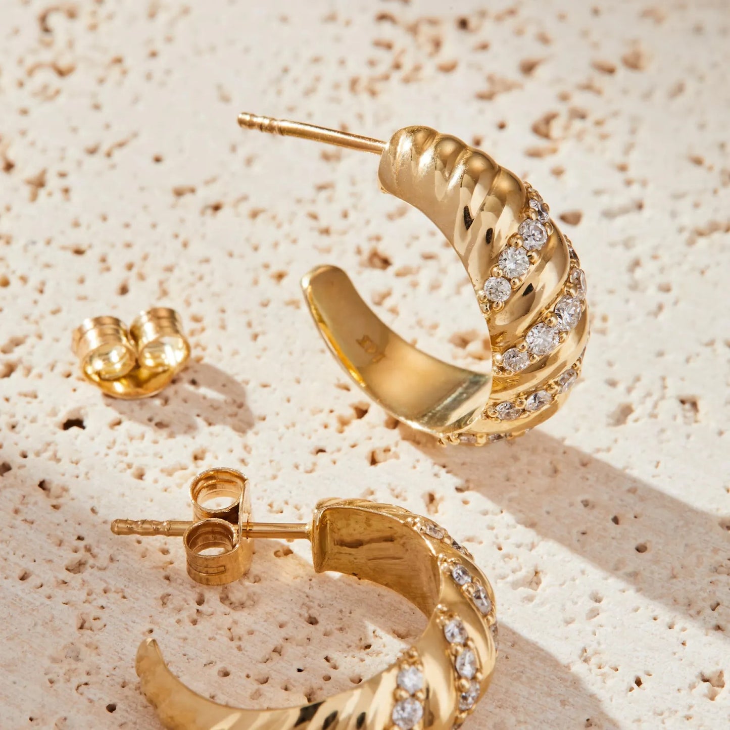 0.80 tcw round cut lab grown diamond huggie hoop earring elegant twist design