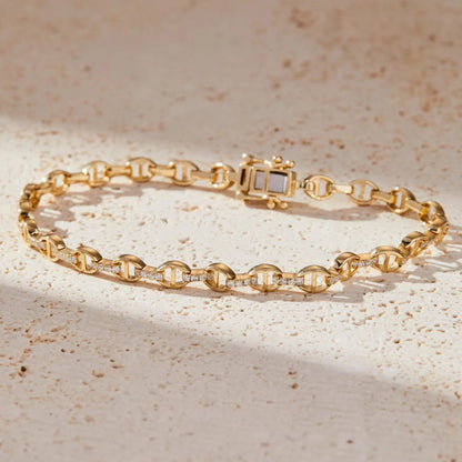 Gold bracelet with a diamond on a beige 