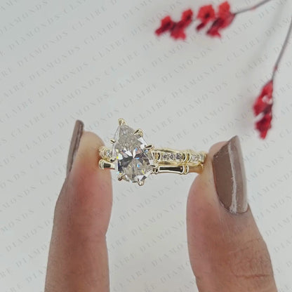 Luxury Pear Cut Moissanite Diamond Engagement Ring with Pavé Diamond Accents and Bamboo Inspired Matching Wedding Band Set