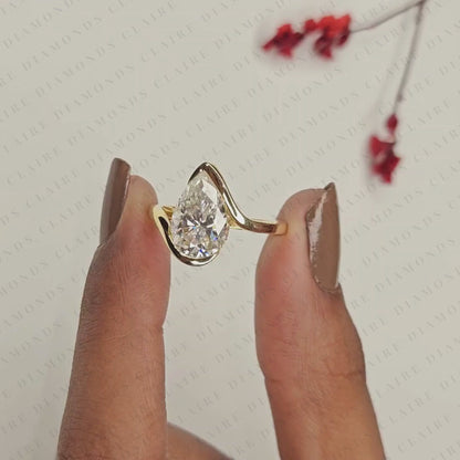 Pear Shape Moissanite Diamond Hidden Halo Solitaire Ring with Contemporary Twist Setting