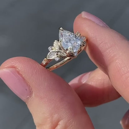 Vintage Inspired Pear Cut Moissanite Diamond Engagement Ring with Floral Leaf Side Accents in Solid Gold